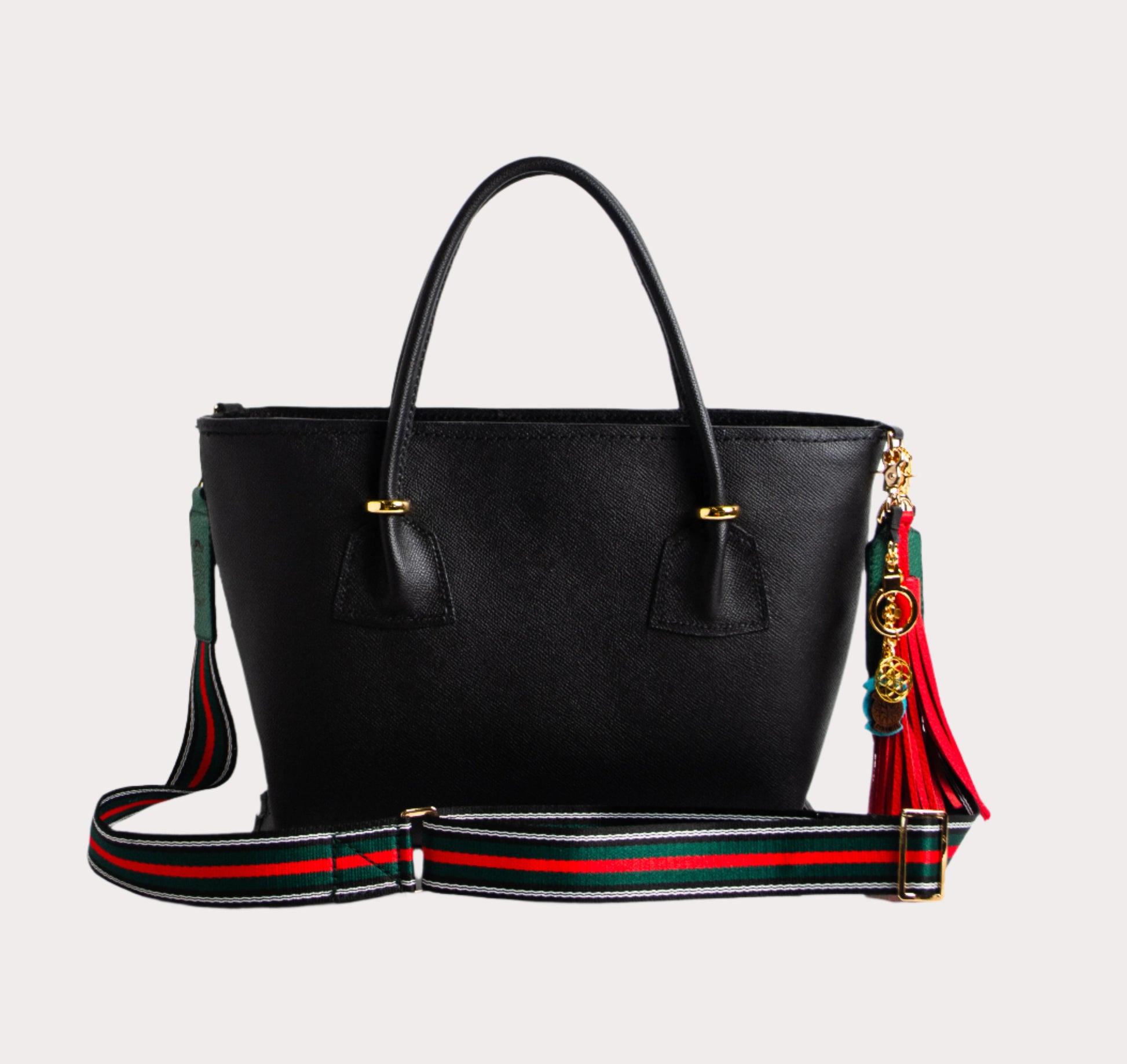 red and green striped bag strap with togo leather ends and laser cut gold hardware